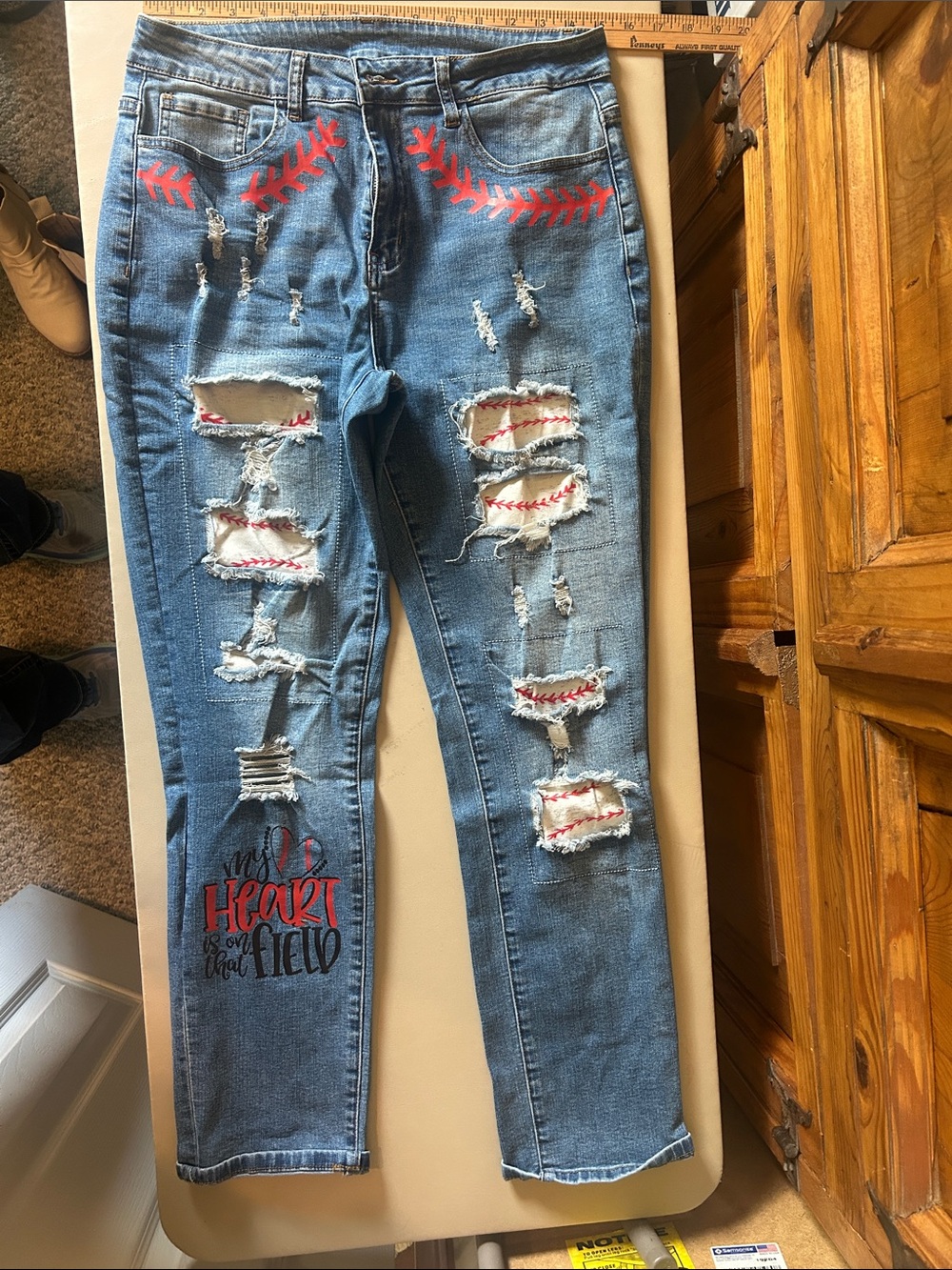 Distressed Light Blue Straight-Leg Jeans with Red Stitch Accents